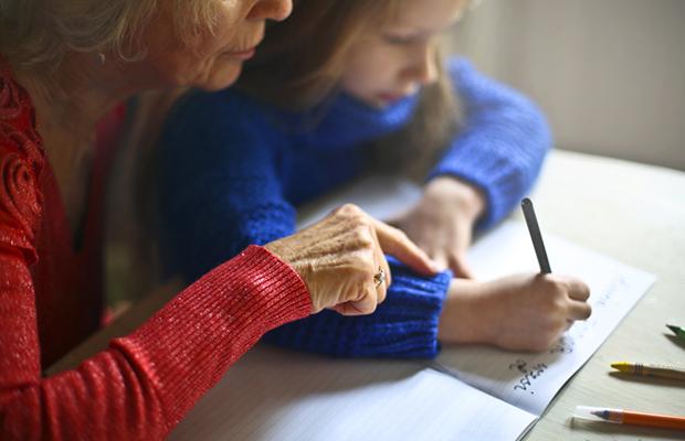 grandma and young girl going over homework