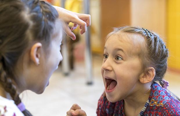 two little girls fighting and yelling